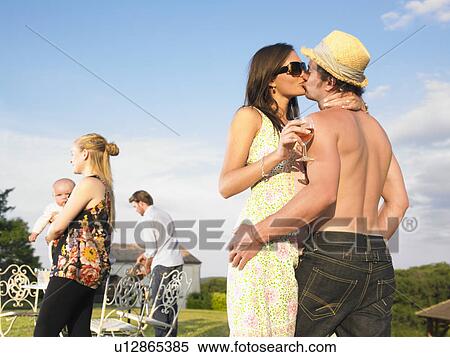 couple kissing at barbecue View Large Photo Image Stock Photography - couple kissing at barbecue. Fotosearch