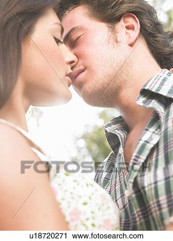 couple kissing View Large Photo Image Stock Image - couple kissing. Fotosearch