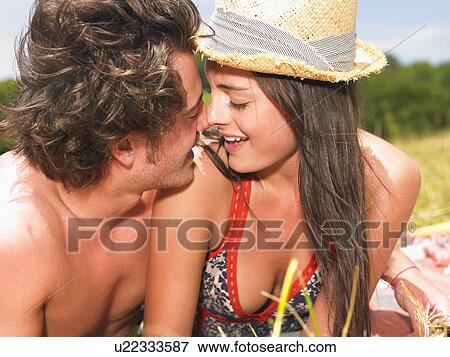 couple on blanket in field View Large Photo Image Stock Photo - couple on blanket in field. Fotosearch