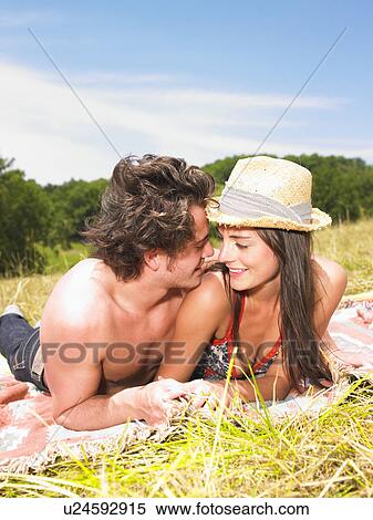 couple on blanket in field View Large Photo Image Stock Photography - couple on blanket in field. Fotosearch
