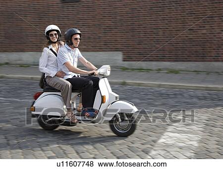 couple on scooter View Large Photo Image Stock Photo - couple on scooter. Fotosearch