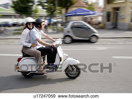 couple on scooter View Large Photo Image Stock Photo - couple on scooter. Fotosearch