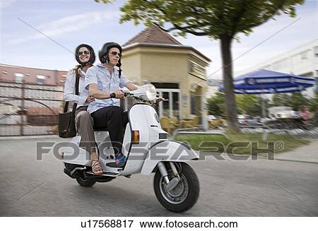 couple on scooter View Large Photo Image Stock Photo - couple on scooter. Fotosearch