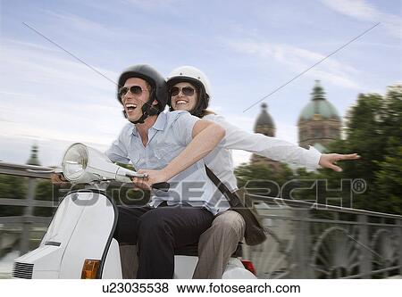 couple on scooter View Large Photo Image Stock Photo - couple on scooter. Fotosearch