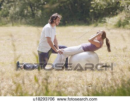 couple on yoga ball stretching View Large Photo Image Stock Photograph - couple on yoga ball stretching. Fotosearch