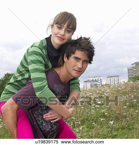 couple piggy backing View Large Photo Image Stock Photography - couple piggy backing. Fotosearch