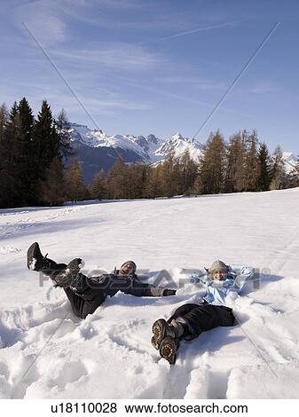 Stock Photo - couple playing in the snow. Fotosearch