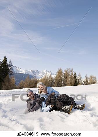 couple playing in the snow View Large Photo Image Stock Photo - couple playing in the snow. Fotosearch