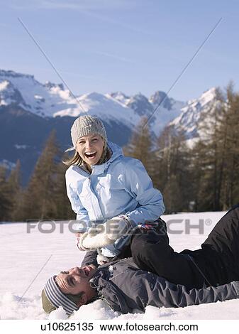 couple playing in the snow View Large Photo Image Stock Photography - couple playing in the snow. Fotosearch