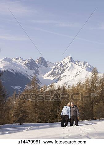 couple pose on snowy mountain View Large Photo Image Stock Image - couple pose on snowy mountain. Fotosearch