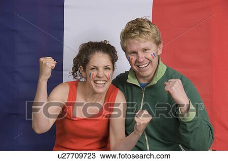 Couple smiling with French flag View Large Photo Image Stock Image - Couple smiling with French flag. Fotosearch