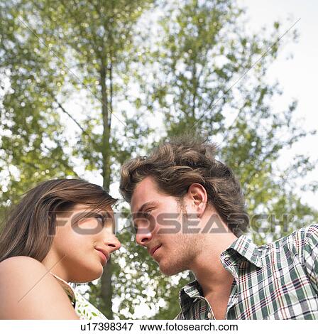 Stock Photo - couple under trees. Fotosearch