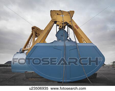 Stock Photography - Crane Grab At Port. Fotosearch