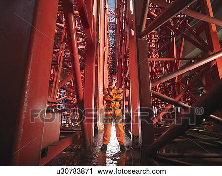 Stock Image - Crane Worker Among Cranes. Fotosearch