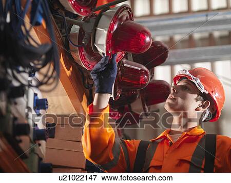 Crane Worker Checking Safety Lights View Large Photo Image Stock Photo - Crane Worker Checking Safety Lights. Fotosearch
