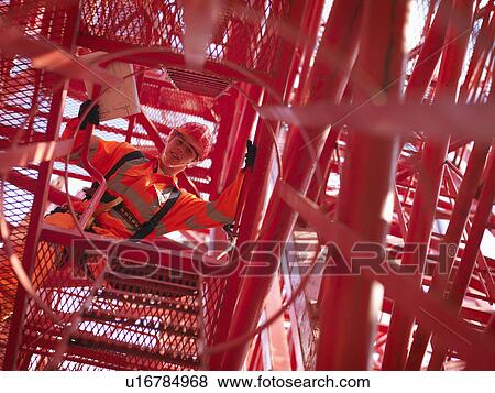 Crane Worker Looking Down From Crane View Large Photo Image Stock Photo - Crane Worker Looking Down From Crane. Fotosearch