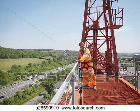 Stock Image - Crane Worker On A Crane. Fotosearch