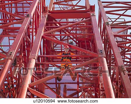 Picture - Crane Worker Standing On Crane. Fotosearch