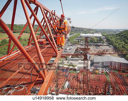 Crane Worker Walking Along Crane View Large Photo Image Stock Photo - Crane Worker Walking Along Crane. Fotosearch