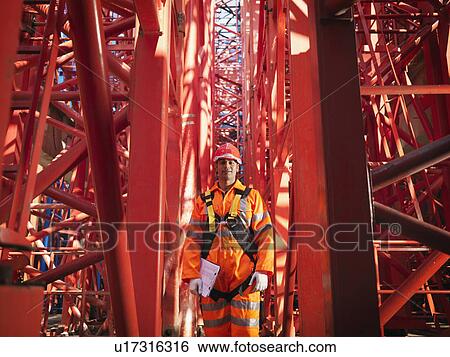 Crane Worker With Harness & Notes View Large Photo Image Stock Photograph - Crane Worker With Harness & Notes. Fotosearch