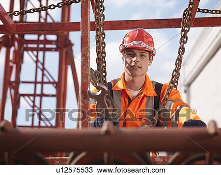 Stock Image - Crane Worker With Spanner. Fotosearch