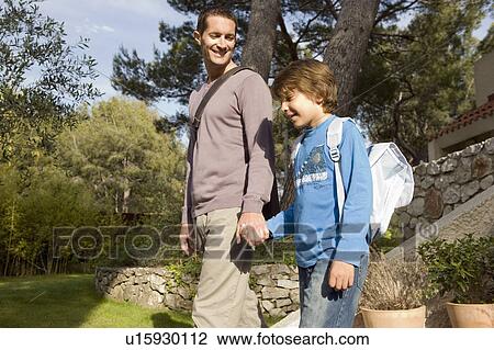 Stock Image - dad and son going to work and to school. Fotosearch
