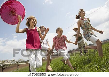 Family having fun in countryside View Large Photo Image Stock Image - Family having fun in countryside. Fotosearch