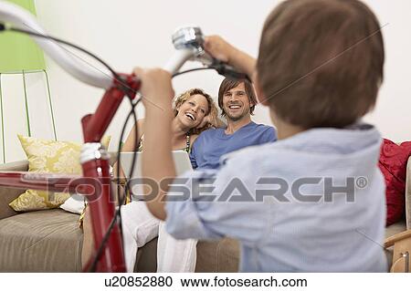 Stock Image - family homeshopping. Fotosearch