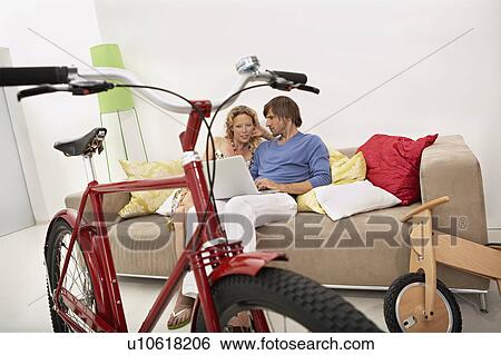 Stock Photograph - family homeshopping. Fotosearch