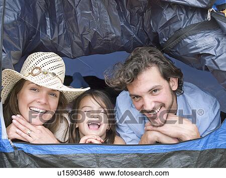 Family lying inside tent laughing View Large Photo Image Stock Photograph - Family lying inside tent laughing. Fotosearch