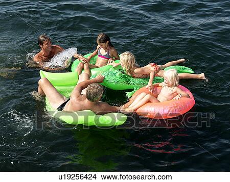 Picture - Family playing in water. Fotosearch