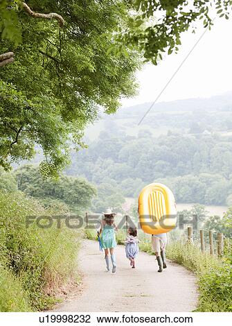 Family running together on lane View Large Photo Image Stock Image - Family running together on lane. Fotosearch