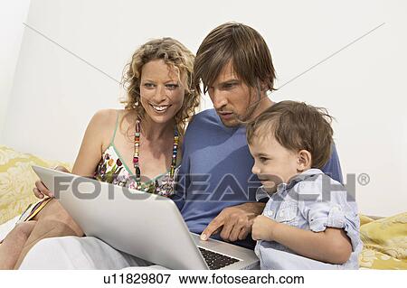family using computer View Large Photo Image Stock Photo - family using computer. Fotosearch