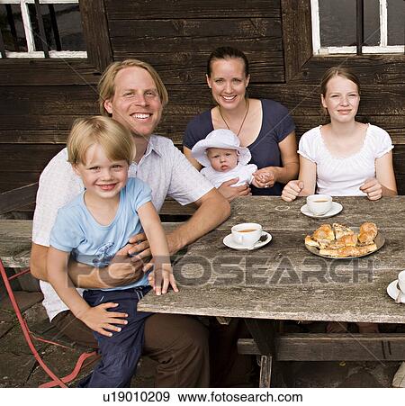 Stock Photo - family with three children. Fotosearch