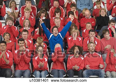 Fan amongst rivals at football match View Large Photo Image Stock Image - Fan amongst rivals at football match. Fotosearch