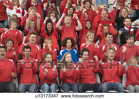 Stock Photo - Fan amongst rivals at football match. Fotosearch