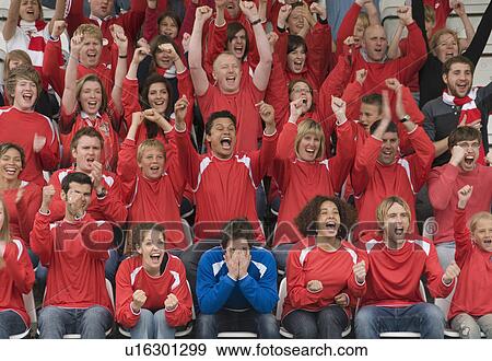 Stock Photo - Fan amongst rivals at football match. Fotosearch