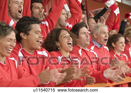 Fans celebrating at football match View Large Photo Image Stock Photography - Fans celebrating at football match. Fotosearch
