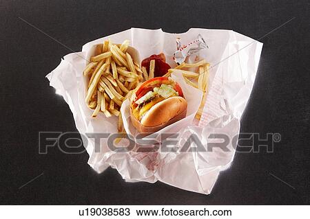 Fast food in take out paper bag View Large Photo Image Stock Image - Fast food in take out paper bag. Fotosearch