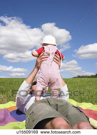 father and baby in field View Large Photo Image Stock Photo - father and baby in field. Fotosearch