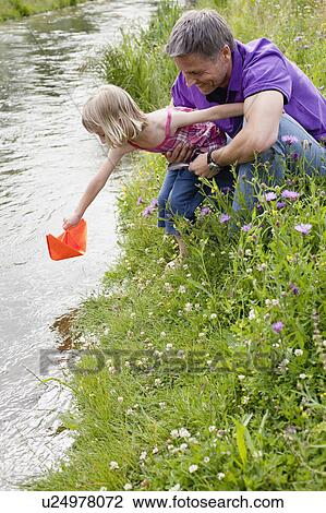 Father and Daughter Playing On Creek View Large Photo Image Stock Image - Father and Daughter Playing On Creek. Fotosearch