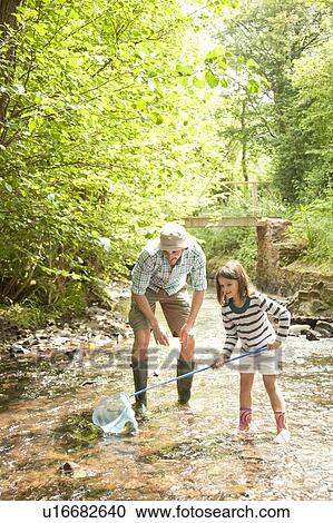 Father and daughter with fishing net View Large Photo Image Stock Image - Father and daughter with fishing net. Fotosearch