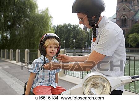 father and son on scooter View Large Photo Image Picture - father and son on scooter. Fotosearch