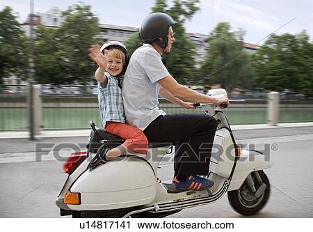father and son on scooter View Large Photo Image Stock Image - father and son on scooter. Fotosearch