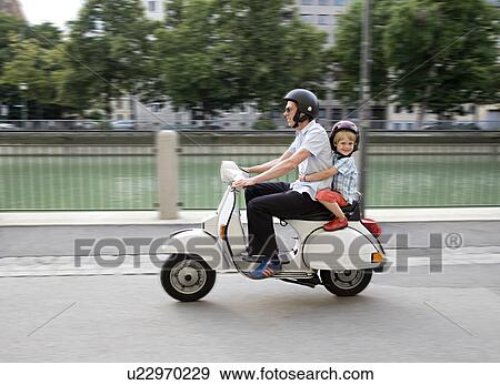 Stock Photo - father and son on scooter. Fotosearch