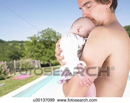 Stock Photo - father holding baby. Fotosearch