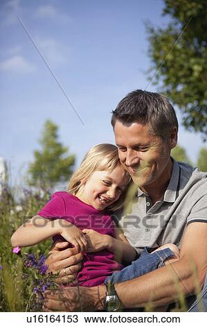 Stock Image - Father Hugging Daughter. Fotosearch