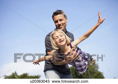 Father Playing Airplane with Girl View Large Photo Image Stock Image - Father Playing Airplane with Girl. Fotosearch