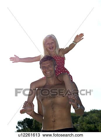 Father with daughter on shoulders View Large Photo Image Stock Image - Father with daughter on shoulders. Fotosearch