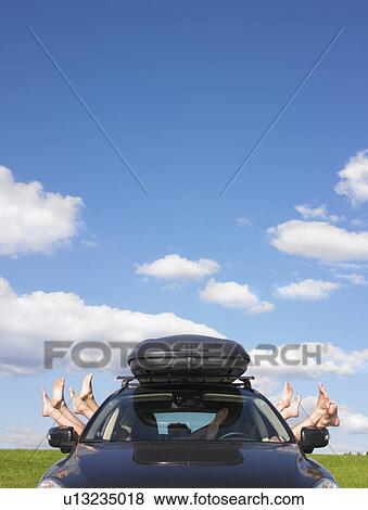 feet out of car windows View Large Photo Image Stock Photo - feet out of car windows. Fotosearch